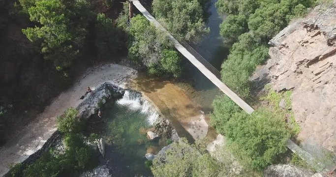 Aerial view of a waterfall and a brige