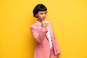 Modern woman with pink business suit with angry gesture