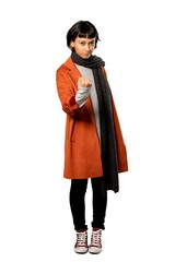 A full-length shot of a Short hair woman with coat with angry gesture over isolated white background