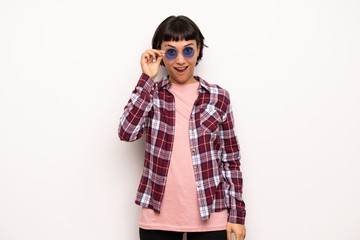 Young woman with short hair with glasses and surprised