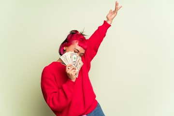 Young woman with red sweater taking a lot of money