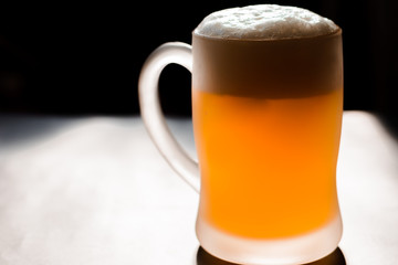glass of beer on dark background , mug of beer