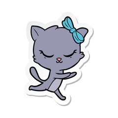 sticker of a cute cartoon cat with bow