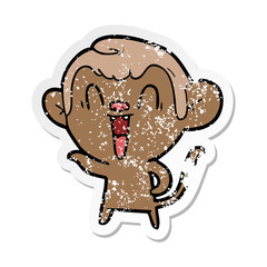 distressed sticker of a cartoon laughing monkey