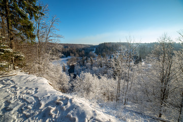 Obraz premium frozen winter landscape with forests and fields covered in snow