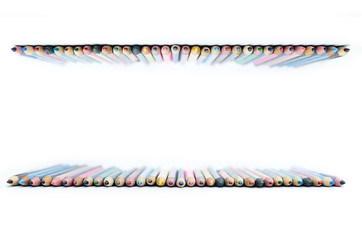 colored pencils laid out in a row, on a white background, will be printed, copy space, 