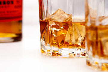 Glasses of scottish whiskey with ice cubes
