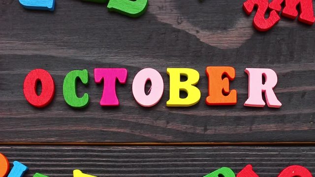 The word october with colored letters