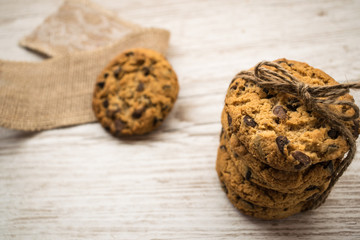 Top view of chocolate chip cookies on a wooden table