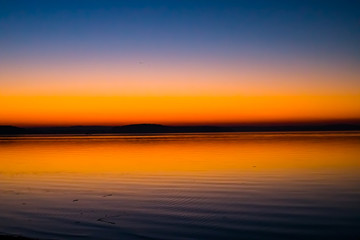 Incredible, bright sunset over the water. Minsk Sea, Belarus