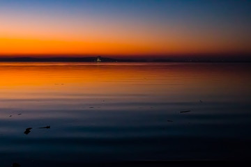 Obraz premium Incredible, bright sunset over the water. Minsk Sea, Belarus