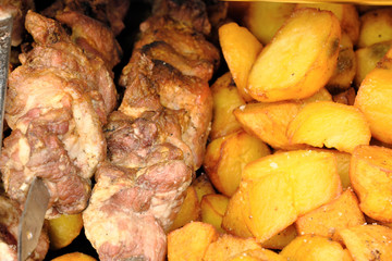 Grilled potatoes and meat