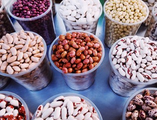 Different colorful dry beans in glasses top view (mobile photography)