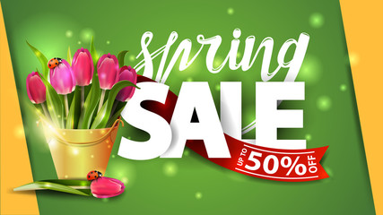 Spring sale. Green banner with bouquet of tulips