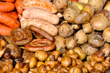 Grilled potatoes and sausages