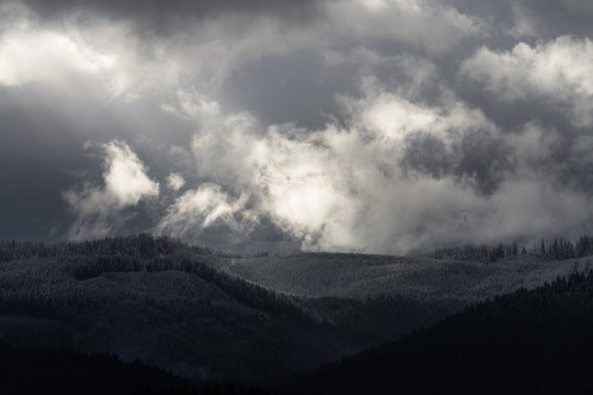 Winters Break - Sun breaks through clouds in the Oregon Coast Range. © PKZ