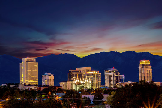 Sunrise Over Salt Lake City With Orange Sky And Street Lights On