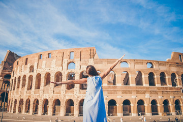 Young woman in front of Colosseum in Rome, Italy. Girl in Europe vacation