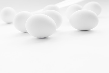 White boiled Easter eggs, uncolored on white background