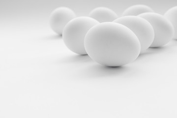 White boiled Easter eggs, uncolored on white background