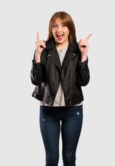 Young redhead woman pointing with the index finger a great idea over isolated grey background