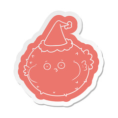 cartoon  sticker of a puffer fish wearing santa hat