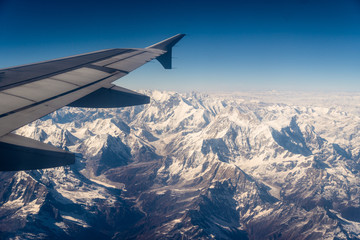 Obraz na płótnie Canvas Aerial view of the snow capped Himalayas in Nepal