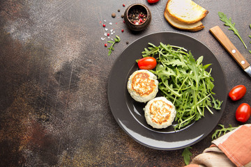 Fried chicken cutlet with herbs, delicious healthy lunch, children's food, diet. Meatballs with salad on dark background