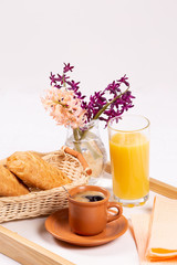 Morning coffee concept. Flowers, coffe and strudel on a tray