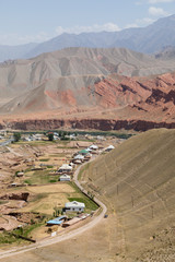 Village with landscape around the famous Pamir Highway M41 in Kyrgyzstan in Central Asia