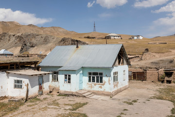 Residential hous of border town Sary-Tash in Kyrgyzstan to neighboring Tajikistan on the Pamir Highway in Central Asia