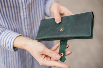 Sky blue handbag purse and beautiful woman hand with manicure