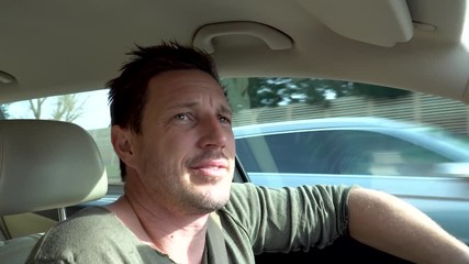 A man driving angry and shouting at the other driver on a highway