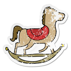distressed sticker of a cartoon rocking horse