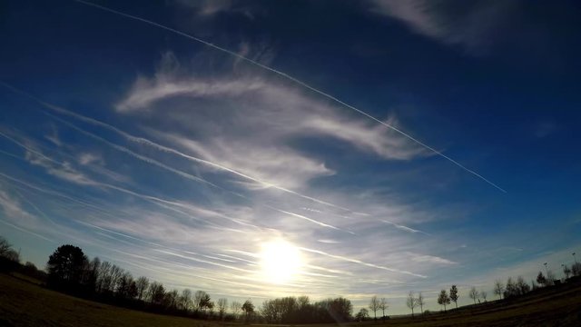 Clear Blue Sky - Some Airplanes coming across - Cemtrail - Sunset