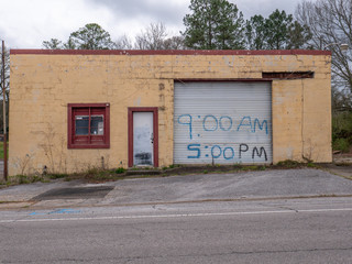 old abandoned brick building with overhead door