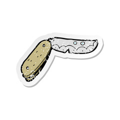 retro distressed sticker of a cartoon folding knife