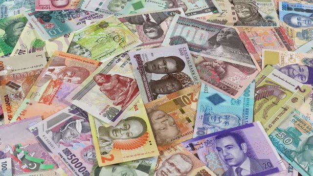 Africa currency notes slow rotating. African money, trade, economy, market. Low angle. 4K stock video footage