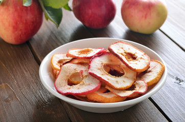 Naklejka na ściany i meble Dried apple rings in white bowl