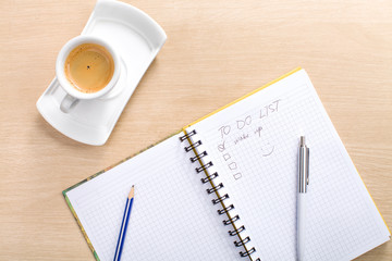 pencil, pen, notebook, cup of hot coffee