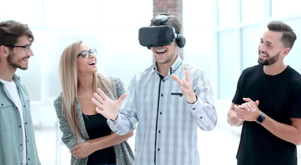 Young doctor watching male in VR goggles