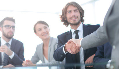 background image of handshake of business partners