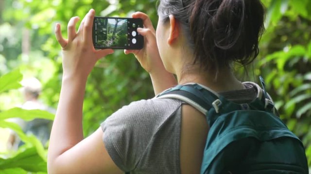 Backpacker Hiker takes picture of scenery in Hawaii shot in slow motion.mp4