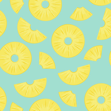 Seamless pattern from sliced pineapple pieces on a green background.