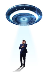 Flying saucer abducting young businessman 