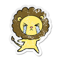 distressed sticker of a cartoon crying lion