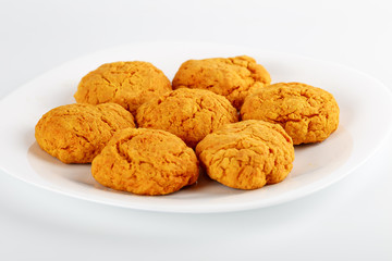 Classic homemade carrot cookies with peanut butter on a white background