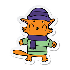 sticker of a cartoon cat in winter clothes