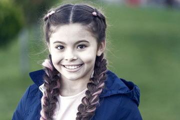 Fototapeta premium Happy child outdoor. Nature landscape. Parks and outdoor. Little girl with trendy hairstyle. Autumn weather. Happy little girl. Spring fashion for little girl. Happy to be around. Childhood happiness