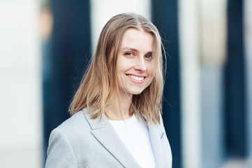 Fototapeta premium Blonde young smiling businesswoman